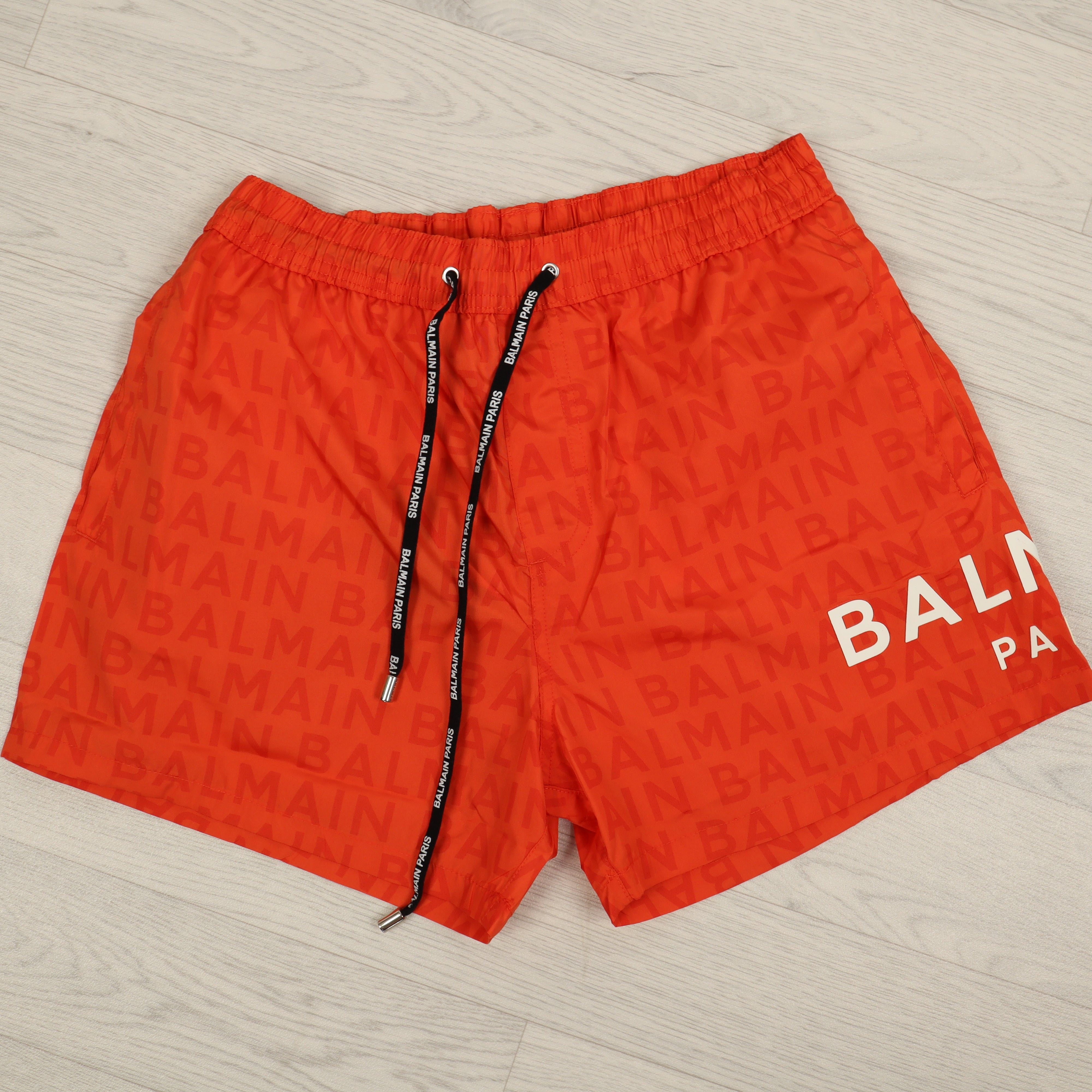 Orange Monogram Swim Shorts.