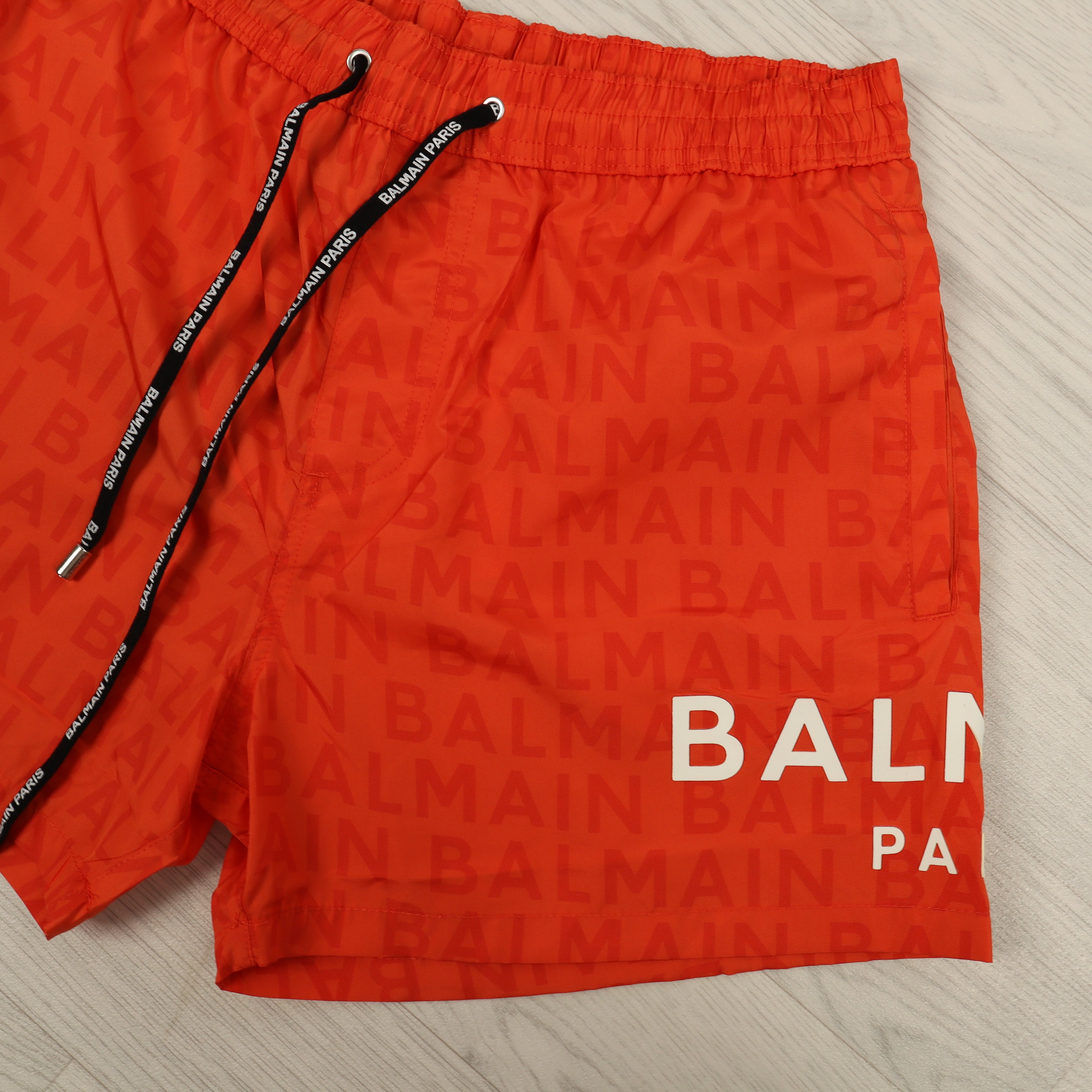 Orange Monogram Swim Shorts.