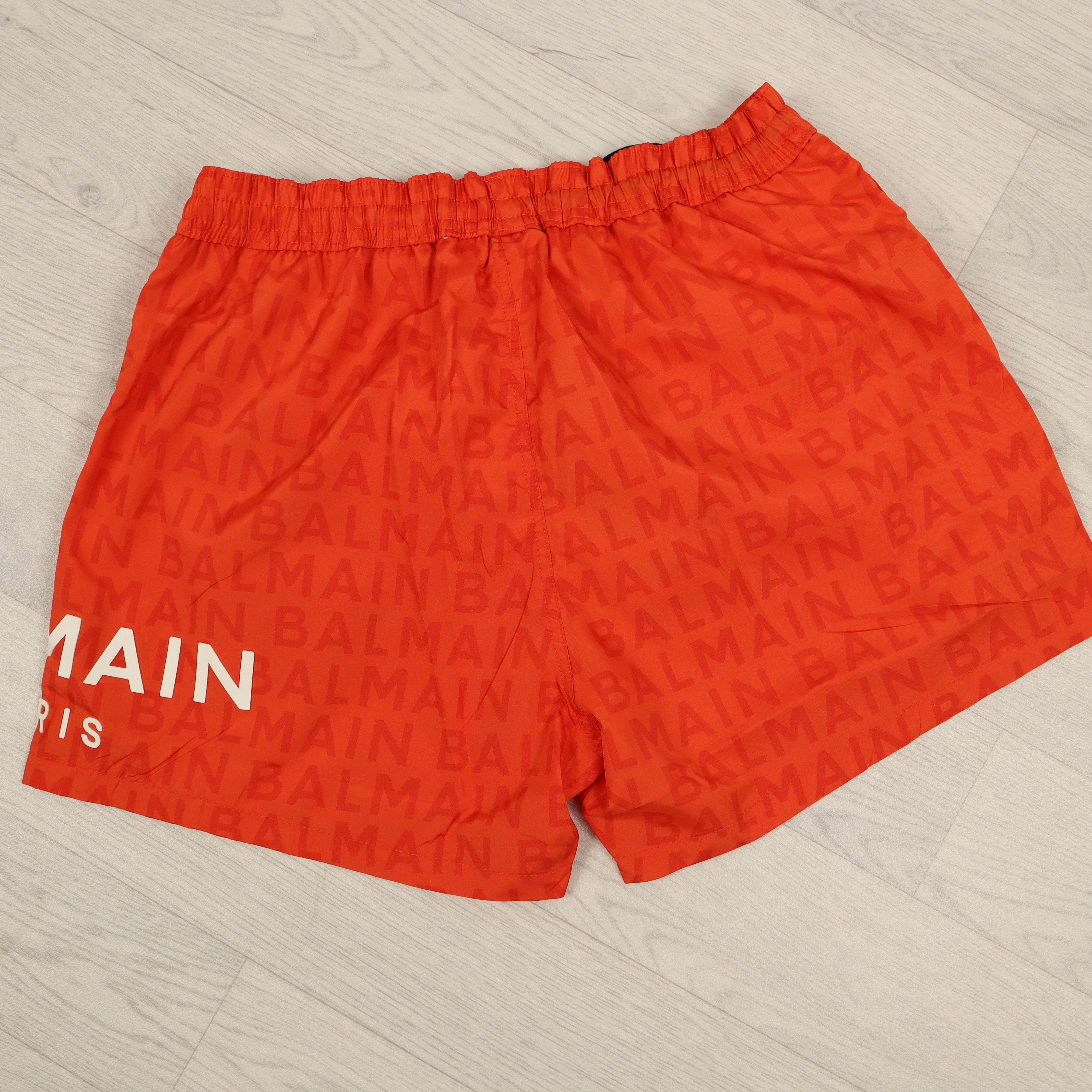 Orange Monogram Swim Shorts.